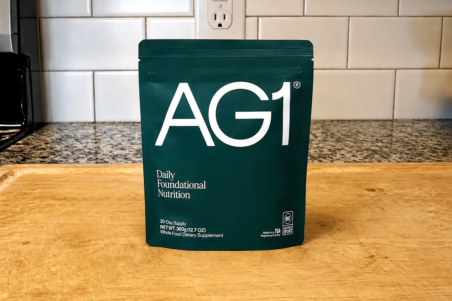 An AG1 pouch on our kitchen counter, 30-day supply, 360 g