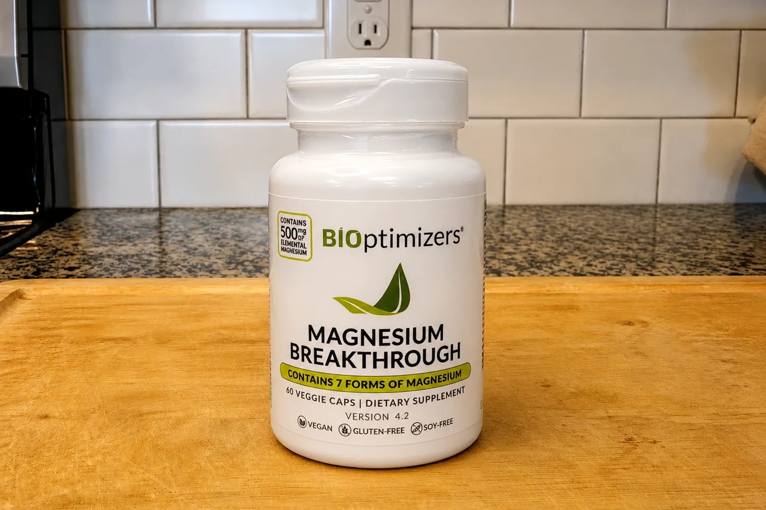 A BiOptimizers Magnesium Breakthrough bottle on our kitchen counter, 60-capsule 30-day supply