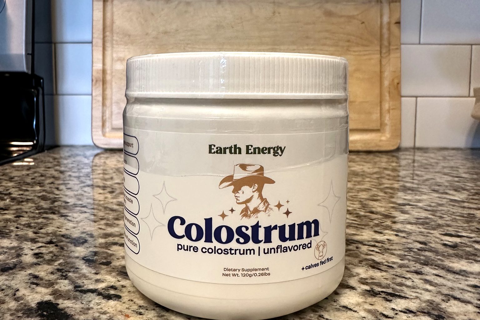 The Earth Energy Pure Bovine Colostrum jar we purchased, photographed on a kitchen counter