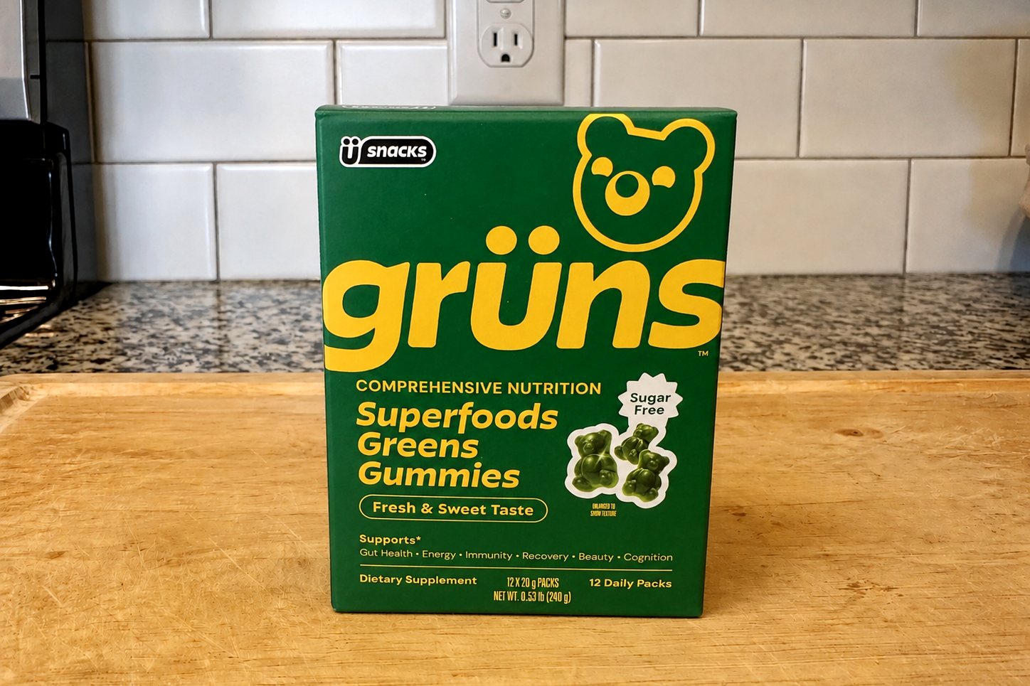 Grüns Superfoods Greens Gummies Sugar Free box on our kitchen counter, front panel with green bear mascot