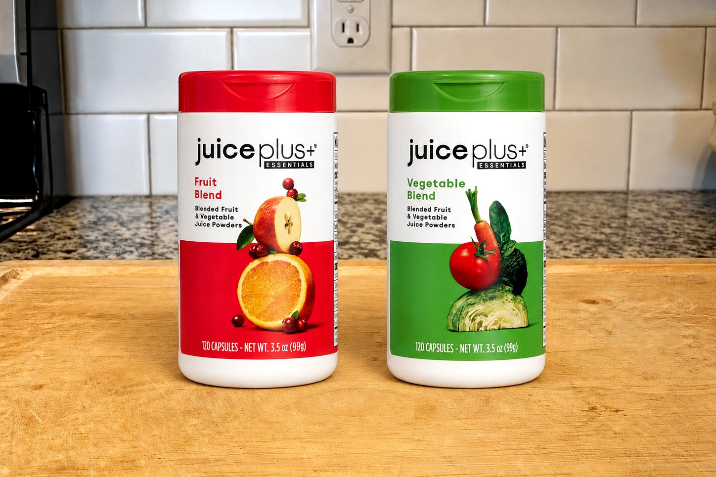 Juice Plus+ Essentials Fruit Blend and Vegetable Blend bottles, 120 capsules each, side by side on our kitchen counter