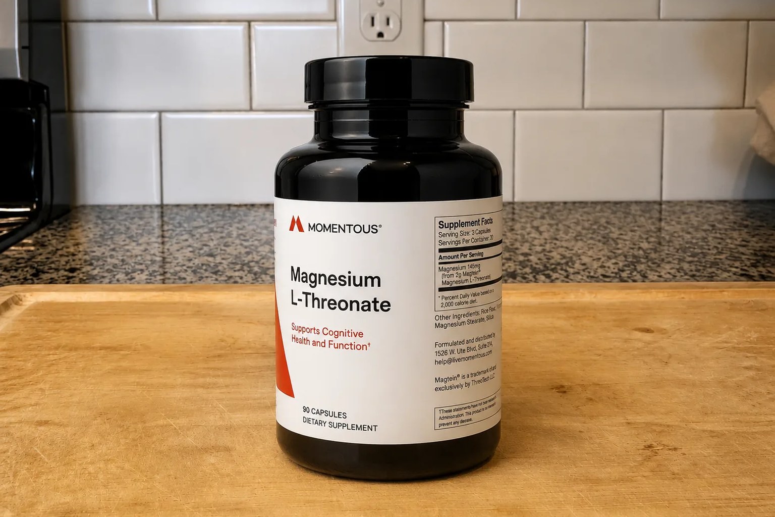 A Momentous Magnesium L-Threonate bottle on our kitchen counter, 90-capsule supply