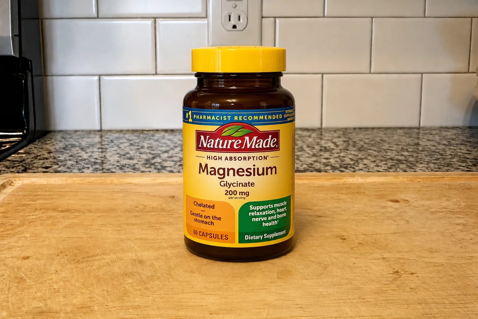 A Nature Made Magnesium Glycinate bottle on our kitchen counter, 60-capsule, 30-serving supply