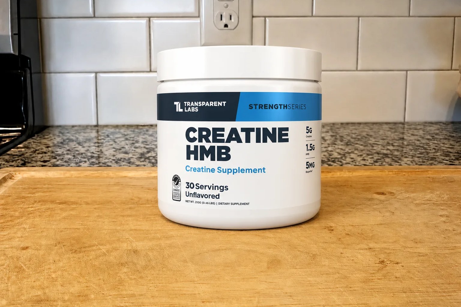 A tub of Transparent Labs Creatine HMB on our kitchen counter, 30-serving size